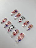 Clowning around press on nails with clown face design, application pack included.
