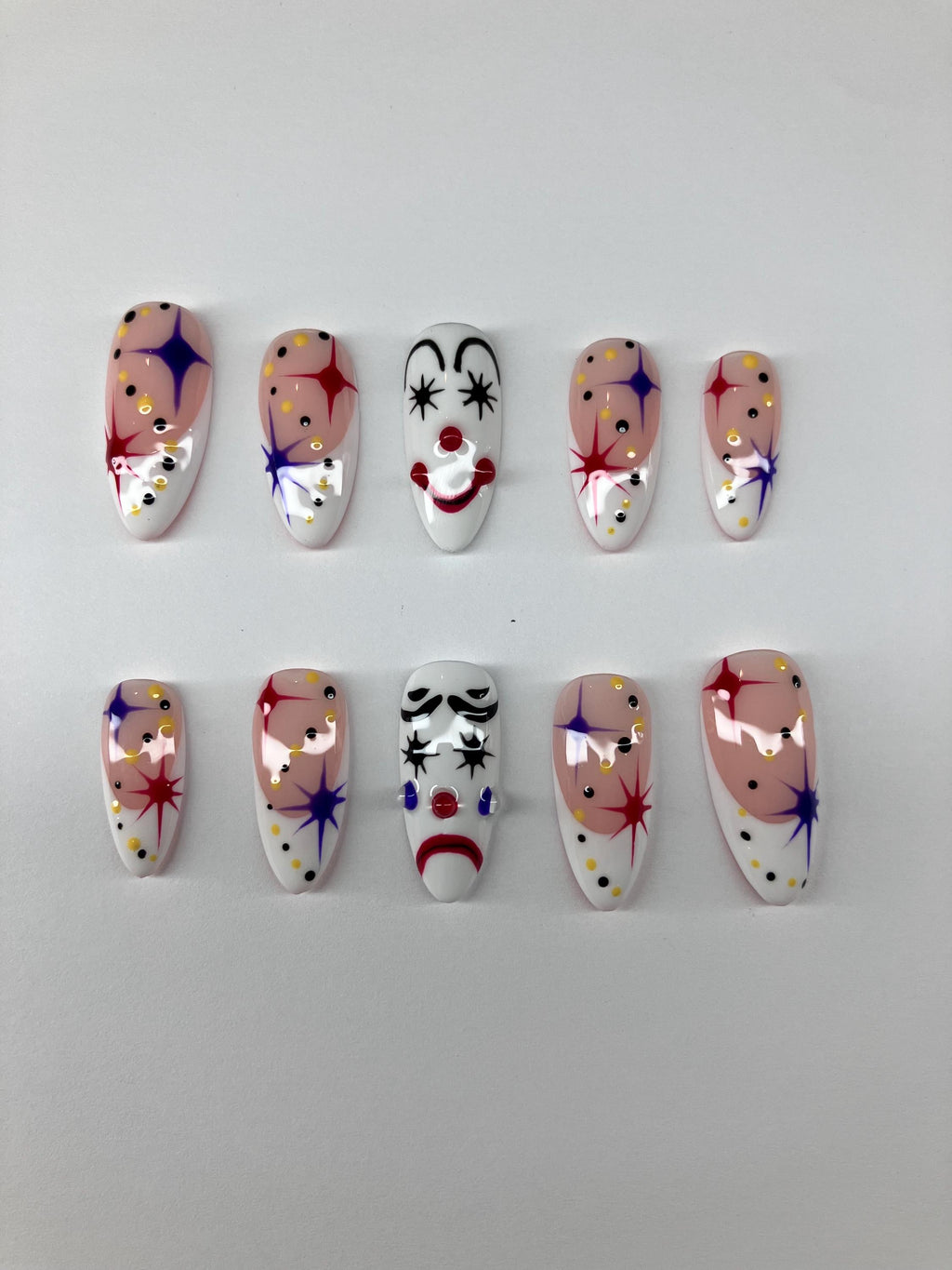 Clowning around press on nails with clown face design, application pack included.