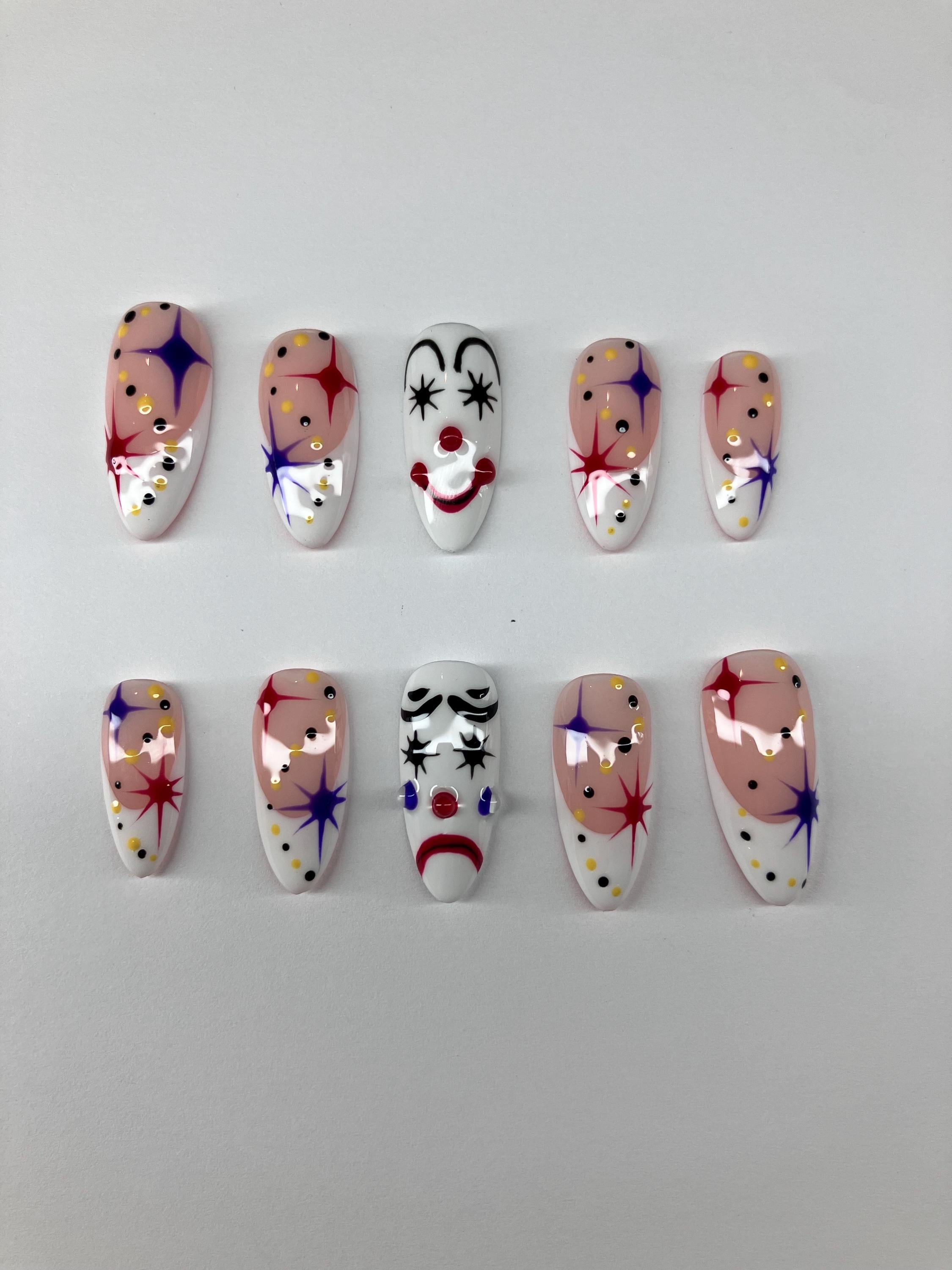 Clowning around press on nails with clown face design, application pack included.