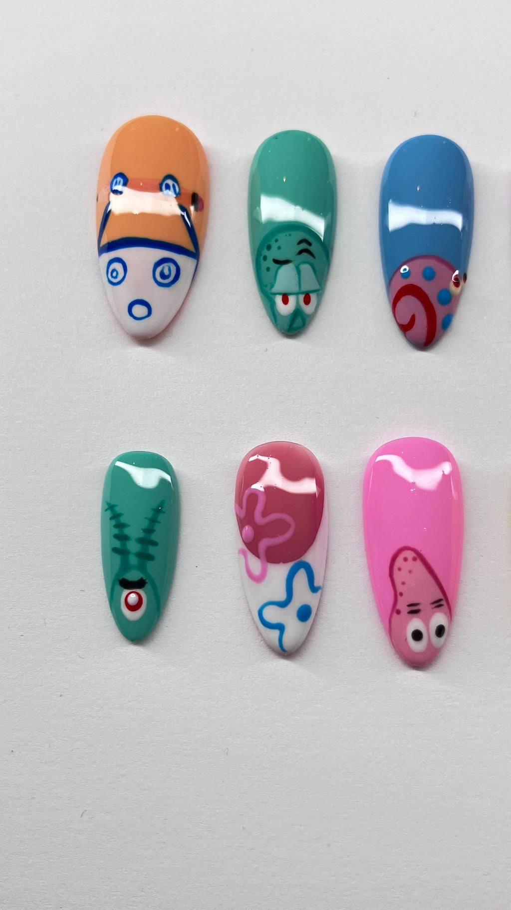 Bikini bottom inspired press on nails with detailed nail art, application pack included