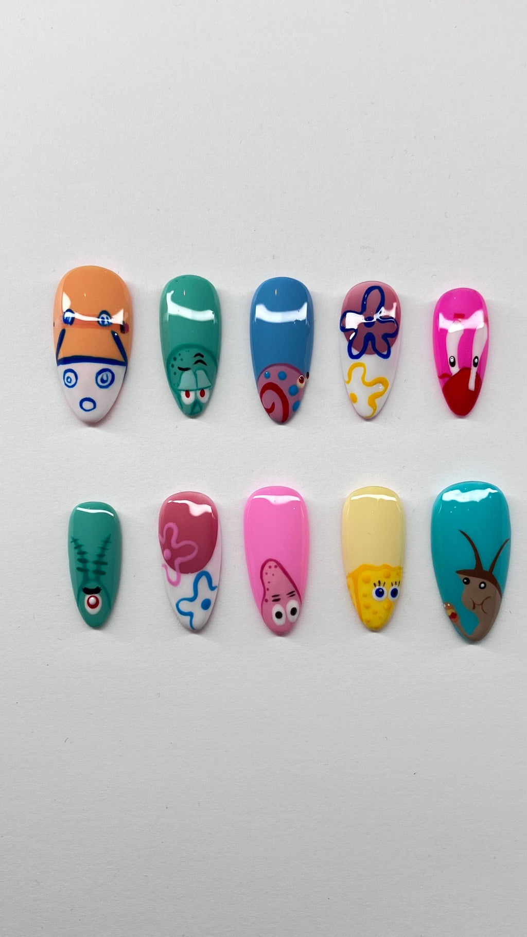 Bikini bottom inspired press on nails with detailed nail art, application pack included