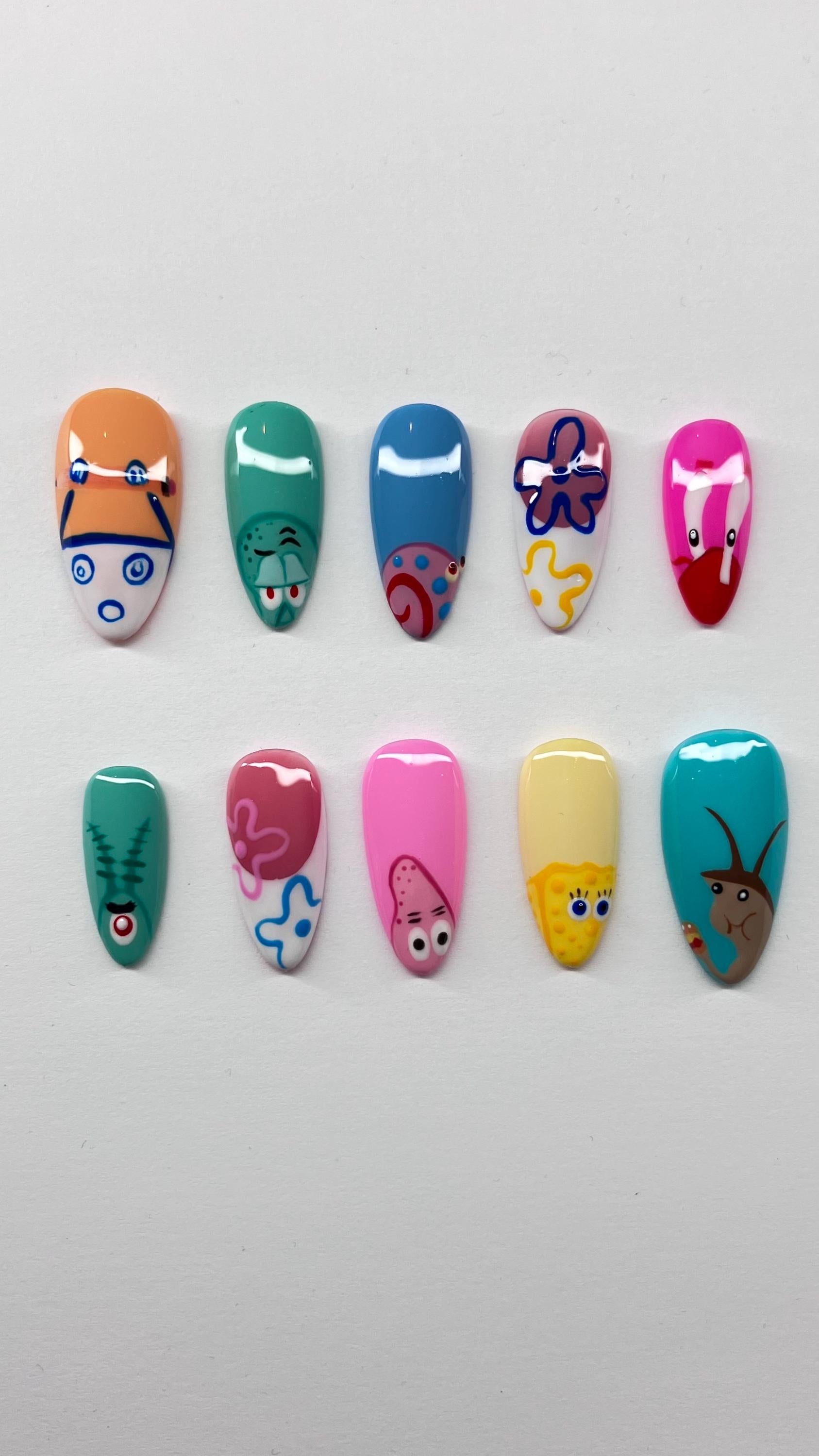 Bikini bottom inspired press on nails with detailed nail art, application pack included