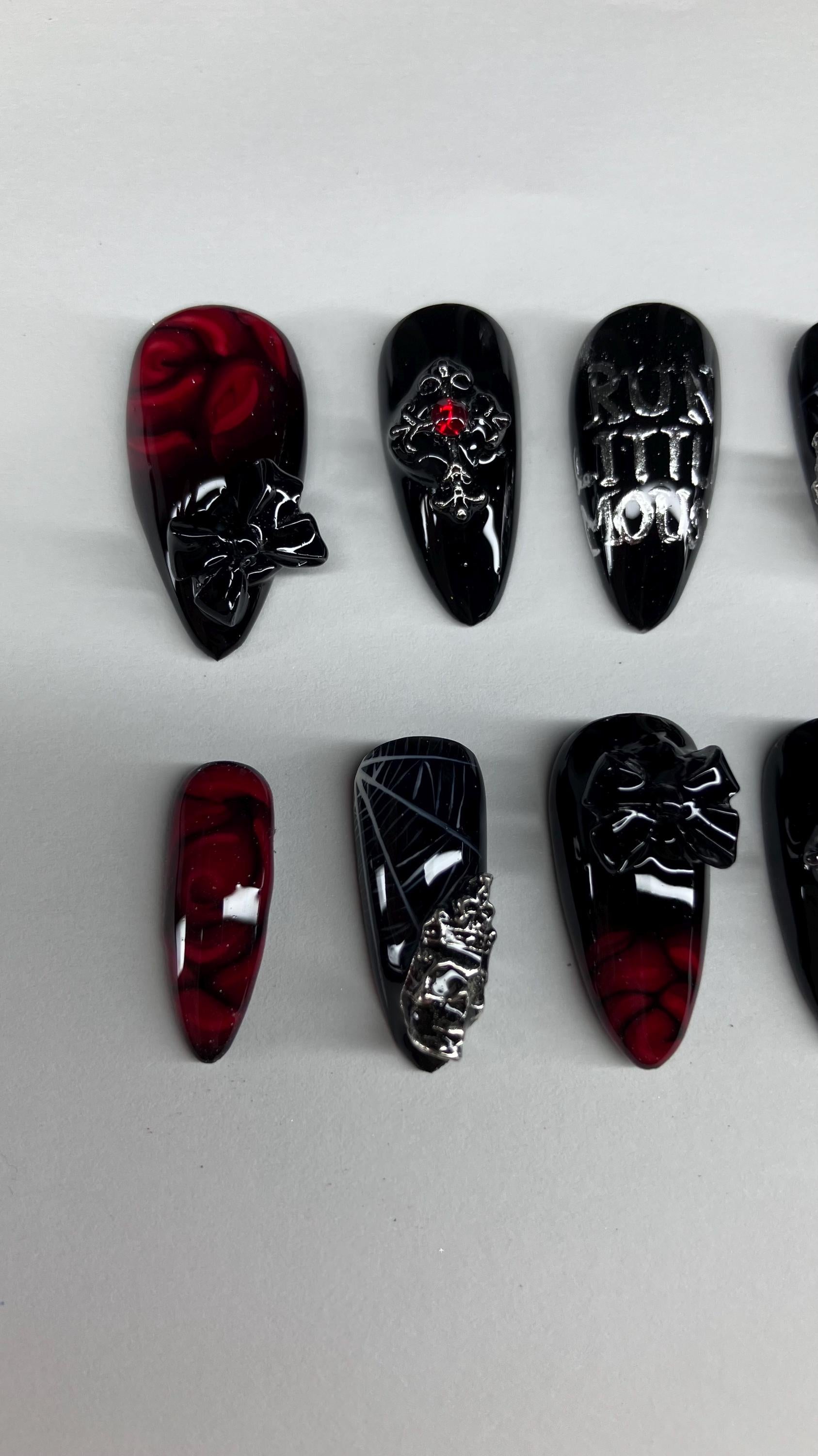 Gothic red and black spider and rose press on nails with application pack included.