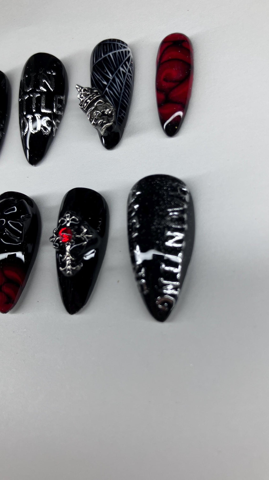 Gothic red and black spider and rose press on nails with application pack included.