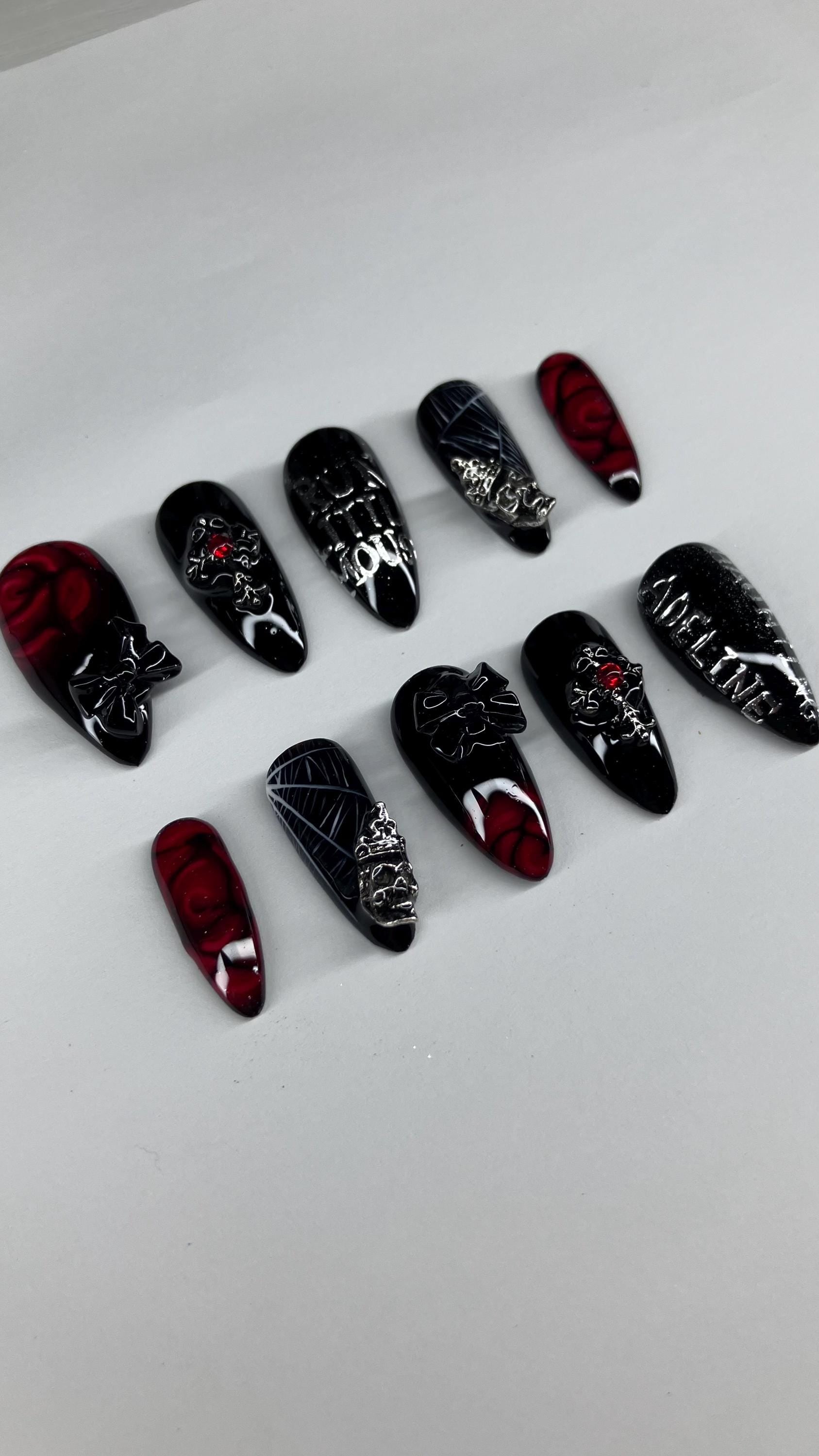 Gothic red and black spider and rose press on nails with application pack included.