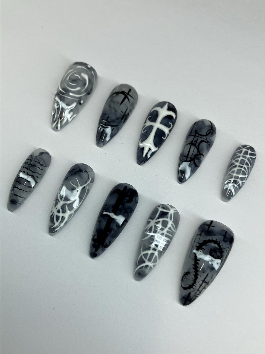 Gothic marble design press on nails, with intricate nail art. Application pack included.