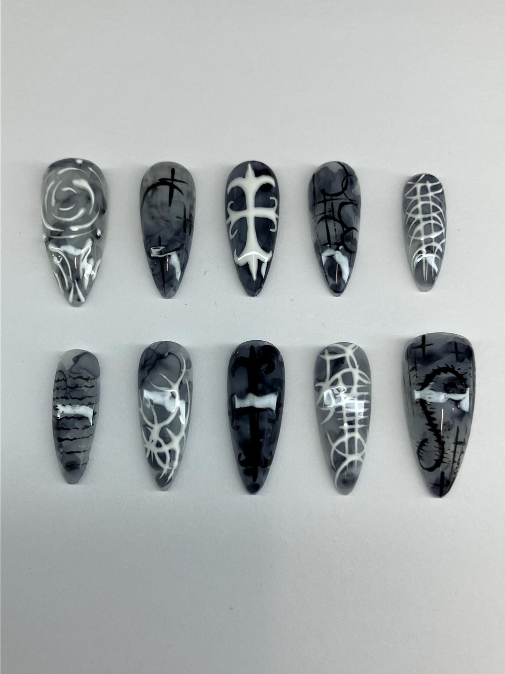 Gothic marble design press on nails, with intricate nail art. Application pack included.